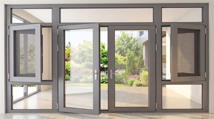 Installed aluminium door and window system opening onto a garden